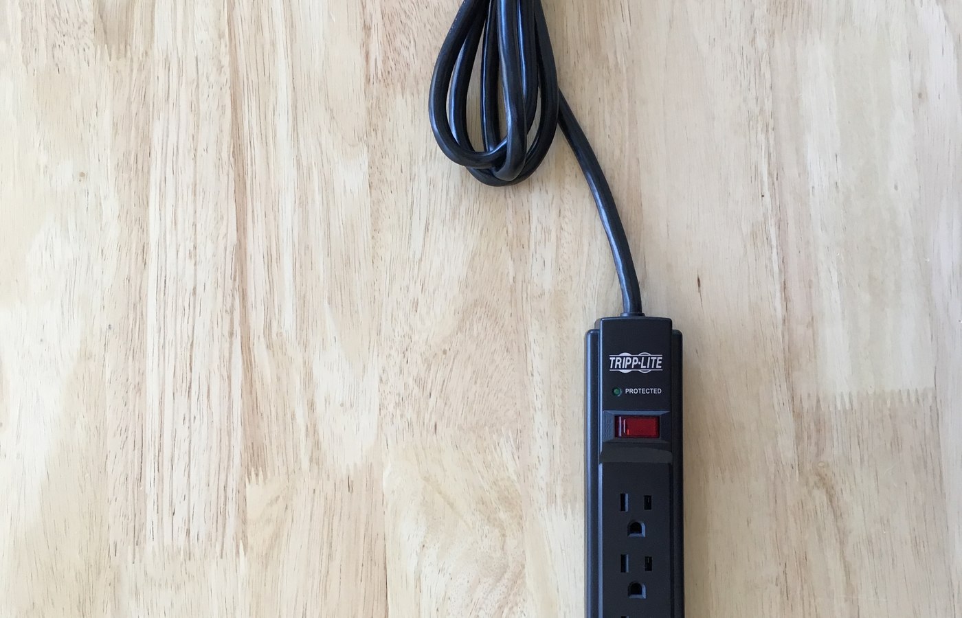 Close view of surge protector or UPS details used to check router continuity and TV and console protection