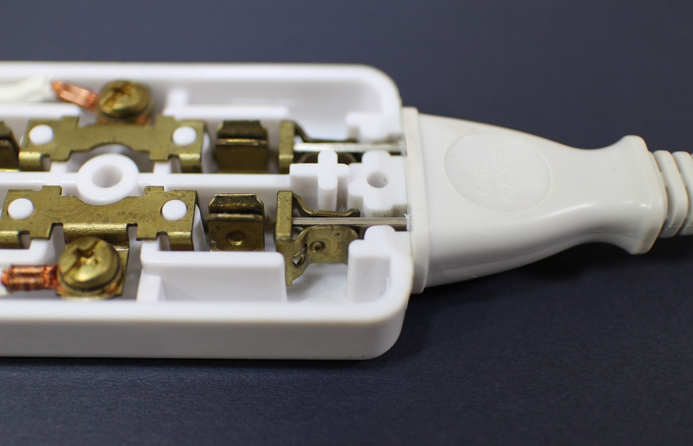 Close view of power strip or extension lead details used to check desk strips and media cabinets